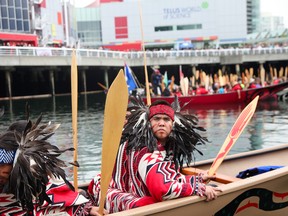 First Nations' gather in False Creek to take part in canoe flotilla event.

David Ball/QMI Agency