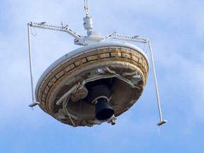 A saucer-shaped test vehicle, which holds equipment for landing large payloads on Mars, is lifted up by a high altitude balloon at the U.S. Navy's Pacific Missile Range Facility in Kauai, Hawaii.

REUTERS/Marco Garcia