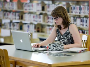 Sarah Cheeseman uses her computer at the Central Public Library in London, Ontario on Friday, June 27, 2014. research.DEREK RUTTAN/ The London Free Press /QMI AGENCY