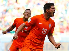Klaas-Jan Huntelaar of the Netherlands celebrates after scoring a goal during their World Cup game against Mexico at the Castelao arena in Fortaleza, Brazil on Sunday, June 29, 2014. (Dominic Ebenbichler/Reuters)