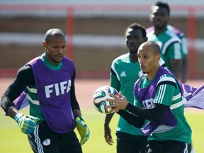 Nigeria's Peter Odemwingie (right) attends a training session ahead of their World Cup game against France, in the Mane Garrincha National Stadium in Brasilia, on Sunday, June 29, 2014. (Ueslei Marcelino/Reuters)