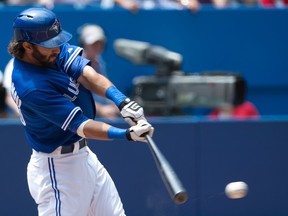 Blue Jays left fielder Darin Mastroianni hits a single during the first inning against the White Sox in Toronto on Sunday, June 29, 2014. It was one of four hits on the day for the Jays as the White Sox won 4-0. (Nick Turchiaro/USA TODAY Sports)