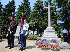 Spencer Russell of Wellington, an air cadet with 608 Duke of Edinburgh Royal Canadian Air Cadet Squadron and a graduate glider pilot from Central Region Gliding School at Canadian Forces Detachment Mountain View in Prince Edward County, stands next to a monument recognizing the service of those who served in Afghanistan since 2002 during a dedication ceremony at Belleville's Cenotaph at Memorial Park Sunday, June 29, 2014.- Jerome Lessard/The Intelligencer/QMI Agency
