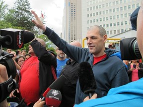 Former NHL player Gino Odjick says he's "overwhelmed" by the attention from hundreds of well-wishers outside Vancouver General Hospital, where the Canuck enforcer battles a terminal illness. (Michael Mui/QMI Agency)