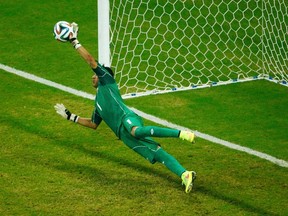 Costa Rica's Keylor Navas saves Greece's Theofanis Gekas' penalty shot during a shootout in their World Cup game at the Pernambuco arena in Recife, Brazil on Sunday, June 29, 2014. (Ruben Sprich/Reuters)