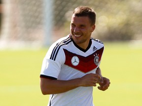 Lukas Podolski is injured and will miss Germany's World Cup game against Algeria on Monday. (Arnd Wiegmann/Reuters)