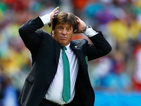 Mexico's coach Miguel Herrera reacts during the last few minutes of their World Cup game against Netherlands at the Castelao arena in Fortaleza, Brazil on Sunday, June 29, 2014. (Marcelo Del Pozo/Reuters)