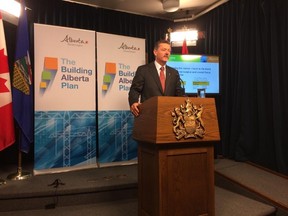 Doug Horner says the province's finances are in a better position than they were last year, claiming the first budget surplus in half a decade. MATT DYKSTRA/EDMONTON SUN
