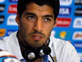 Uruguay's national soccer team player Luis Suarez attends a news conference prior a training session at the Dunas Arena soccer stadium in Natal, June 23, 2014. (REUTERS/Carlos Barria)