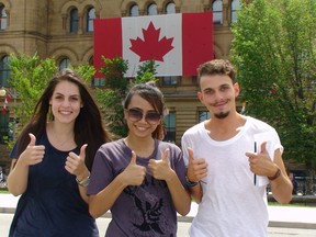 Shown here left to right are Natalia Rivera, Fang Pongpap and Francisco Antonelli who are excited to be in Ottawa for the first time for Canada Day on Tuesday, July 1, 2014.
Danielle Bell/Ottawa Sun/QMI AGENCY