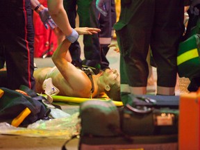 Toronto EMS treat a stabbing victim near Danforth and Victoria Park Aves. early Tuesday. (MANNY RODRIGUES/Special to the Toronto Sun)