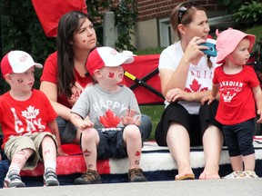 Spectators watch the Canada Day parade pass. (BRENT BOLES, The London Free Press)