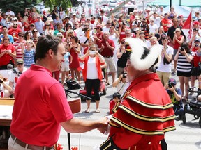 Kingston Mayor Mark Gerretsen presents Town Crier Chris Whyman with a key to the city to mark Whyman's 30 years of service. ELLIOT FERGUSON/THE WHIG-STANDARD