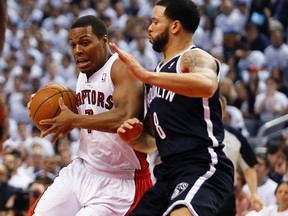 Nets guard Deron Williams (right) defends against Raptors’ Kyle Lowry. The Rockets, who gave up on Lowry and traded him to the Raptors, made a strong push to get him back yesterday. (USATODAY)