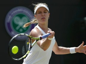 Eugenie Bouchard hits a shot against Angelique Kerber in a Wimbledon quarterfinal. (Max Rossi, Reuters)