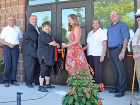 The official ribbon cutting of the newly renovated Elma Logan Recreation Complex took place during the opening ceremonies at the 2nd annual Monkton Rhubarb Festival on Saturday, June 21. From left are: Perth-Wellington MPP Randy Pettapiece, Perth-Wellington MP Gary Schellenberger, Diane Hahn, the fundraising chair for the building at the time it was built in 1990; Tanya Quipp, fundraising chair; North Perth Mayor Julie Behrns, West Perth Mayor Walter McKenzie and West Perth Coun. Gordon Young. KRISTINE JEAN/MITCHELL ADVOCATE