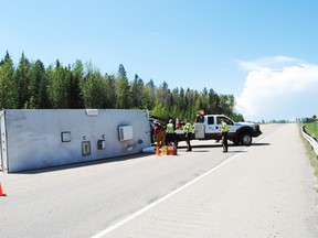 Emergency crews closed the north bound lanes of Highway 43 near Chickadee Creek after a pickup towing a trailer hit the guard rail and the trailer overturned on
Tuesday, June 24, 2014. Barry Kerton photo | Whitecourt Star