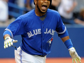Toronto Blue Jays left fielder Edwin Encarnacion celebrates after hitting a walkoff home run against the Milwaukee Brewers at the Rogers Centre in Toronto, July 2, 2014. (DAN HAMILTON/USA Today)