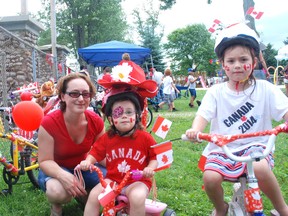 Sue Rabideau, left, borught her daughters, Isabel and Gwenyth to the Old Boys Park in Newbury on Canada Day for some family fun. The girls decorated their bikes for a contest.
