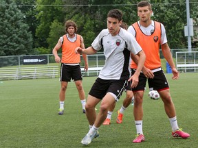 Drew Beckie (in white) practises with teammates Wednesday. (CHRIS HOFLEY/OTTAWA SUN)