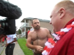 East York resident Joe Killoran confronted Toronto Mayor Rob Ford durring the East York Canada Day Parade. (Jack Boland/Toronto Sun)