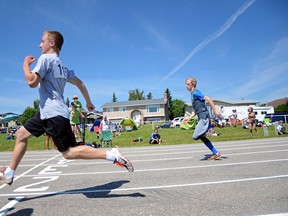 Logan Boras, 14, of Lethbridge won the gold with a 12.63 second 100-metre dash in his division. Eric Grier of Pincher Creek followed closely to snag silver with a 13.09 second sprint. John Stoesser photo/QMI Agency