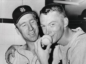 Detroit Tigers pitcher Jim Bunning, right, celebrates after throwing a no-hitter against the Boston Red Sox on July 20, 1958.