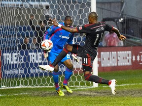 Toronto FC midfielder Jackson scored a goal against Fire goalkeeper Sean Johnson in Chicago last night. (USATODAY)