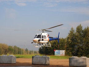 RCMP Helicopter MPP was in Whitecout on Thursday, July 3 assisting in the search for missing resident Dietmar Tews. Tews returned home Thursday morning, safe and sound, after being missing since Canada Day. Bryan Passifiume photo | QMI Agency