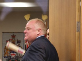 Mayor Rob Ford invites the members of the 2014 CIMA Toronto Mayor's Cricket Team to his office on Thursday, July 3, 2014. Ford would not leave his office and had security guarding the door. (VERONICA HENRI/Toronto Sun)