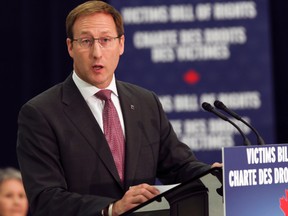 Federal Justice Minister Peter MacKay continues to receive some well-deserved flak for his differing messages to mothers and fathers. (Dave Thomas/QMI Agency file photo)