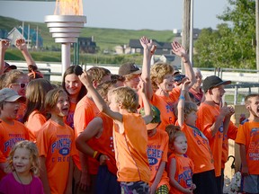 Brenda Shenton, who competed in the original 1970 SASG, cheers with the surrounding Pincher Creek athletes. John Stoesser photo/QMI Agency