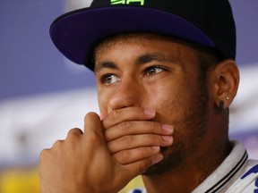 Brazil's national soccer team player Neymar pauses during a news conference in Teresopolis, near Rio de Janeiro, July 2, 2014. (REUTERS/Marcelo Regua)