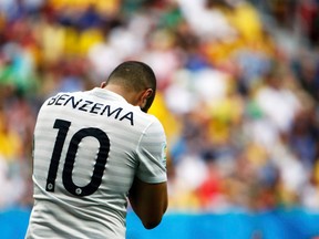 France's Karim Benzema reacts after missing a goal opportunity against Nigeria during their World Cup Round of 16 game at Brasilia National Stadium in Brasilia, Brazil, June 30, 2014. (JORGE SILVA/Reuters)