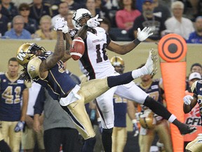 Winnipeg Blue Bombers defensive back Johnny Sears (l) breaks up a pass intended for Ottawa RedBlacks wide receiver Marcus Henry during CFL football in Winnipeg, Man. Monday July 03, 2014.
Brian Donogh/Winnipeg Sun/QMI Agency