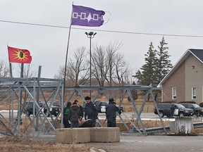 A large number of Ontario Provincial Police officers arrived in Caledonia, Ontario on Friday, January 27, 2011 ahead of a planned rally by protester Gary McHale at the Douglas Creek Estates reclamation site.  McHale was arrested after posting racist signs at the site where, in February 2006, native activists occupied a residential construction site. 
BRIAN THOMPSON/BRANTFORD EXPOSITOR