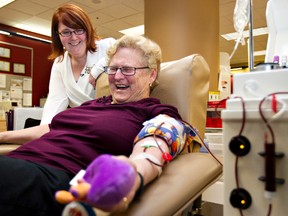 Blood redipient Liz Furber, left, and Edmonton's top female blood donor Sandy Draper chat during Draper's 802nd donation at the Edmonton Blood Donor Clinic in Edmonton, Alberta on Wednesday, December 7, 2011. It took approximately 500 donations to save Furber's life when, in 2005, she suffered severe complications from E Coli and Campylobacter.  More donors are needed during the busy holiday season. Edmonton Sun