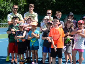 A group of  Kingston Tennis Club summer camp participants and their instructors on the courts Friday. (Alex Pickering/For The Whig-Standard)