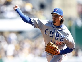 Chicago Cubs starting pitcher Jeff Samardzija (29) delivers a pitch against the Pittsburgh Pirates during the first inning of an opening day baseball game at PNC Park on Mar 31, 2014 in Pittsburgh, PA, USA. (Charles LeClaire/USA TODAY Sports)