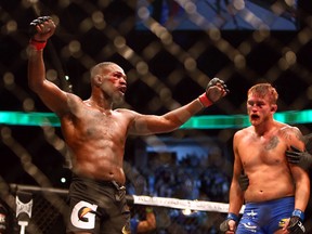 Jon Jones (red) defeats Alexander Gustafsson (blue) during the light heavyweight championship bout during UFC 165 at the Air Canada Centre in Toronto on Sunday September 22, 2013. (Dave Abel/QMI Agency)