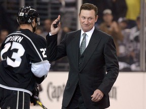 Los Angeles Kings former player Wayne Gretzky waves to the crowd after the ceremonial puck drop before game one of the 2014 Stanley Cup Final against the New York Rangers at Staples Center on Jun 4, 2014 in Los Angeles, CA, USA. (Kirby Lee/USA TODAY Sports)