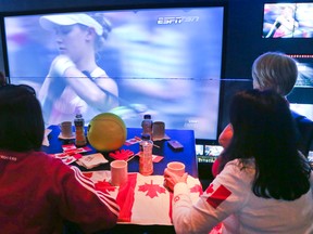 Proud, but disappointed Canadian tennis fans gathered at Real Sports Bar and Grill  in Toronto, Ont. on Saturday, July 5, 2014 to watch Eugenie Bouchard  of Montreal as she lost to Petra Kvitova 6-3, 6-0 at Wimbleton in the Women's singles final. (Veronica Henri/Toronto Sun)