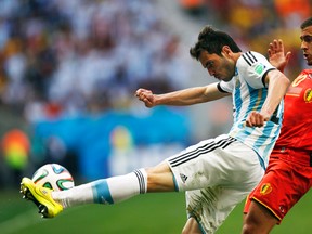 Argentina's Jose Basanta kicks the ball in front of Belgium's Eden Hazard during their World Cup quarterfinal match at Brasilia National Stadium in Brasilia, July 5, 2014. (UESLEI MARCELINO/Reuters)