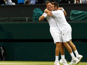 Vasek Pospisil (left) and Jack Sock celebrate defeating Bob and Mike Bryan in the Wimbledon men's doubles final at the All England Club in London, July 5, 2014. (SUZANNE PLUNKETT/Reuters)