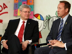 Prime Minister Stephen Harper and Minister of Justice Peter MacKay talk during a photo opportunity before announcing plans for tougher laws for sexual criminals, at the Banbury Community Centre in Toronto in this August 29, 2013 file photo. (Dave Abel/QMI Agency)