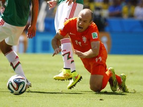 Arjen Robben of the Netherlands reacts after being fouled during their 2014 World Cup round of 16 game against Mexico at the Castelao arena in Fortaleza June 29, 2014. (REUTERS/Murad Sezer)