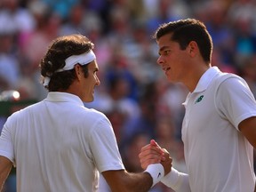 Roger Federer (right) showed Milos Raonic that the young Canadian still has a long ways to go to beat the big boys. (Reuters)