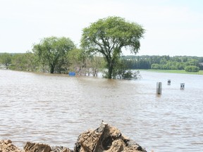 Near Brandon's 18th Street, Grand Valley Road has been closed for days due to flooding. (KRISTIN ANNABLE/Winnipeg Sun)