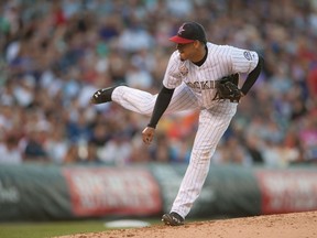 Jair Jurrjens #41 of the Colorado Rockies pitches against the Los Angeles Dodgers during a game at Coors Field on July 4, 2014 in Denver, Colorado. The Dodgers led the Rockies 8-0 after the sixth inning. (Dustin Bradford/Getty Images/AFP)