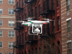 A camera drone flies near the scene where two buildings were destroyed in an explosion, in the East Harlem section in New York City in this file photo from March 12, 2014.   REUTERS/Mike Segar/Files